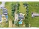 An expansive aerial view displays a home with a pristine pool nestled within a verdant landscape at 7221 State Road 42, Martinsville, IN 46151