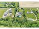 Expansive aerial view of the property showcasing the home, pool, and surrounding acreage at 7221 State Road 42, Martinsville, IN 46151