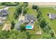 Spacious property with a private in-ground pool, fenced backyard, and mature trees creating a private oasis at 7221 State Road 42, Martinsville, IN 46151