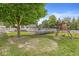Expansive backyard with a playset and a swimming pool area, offering ample space for recreation and outdoor activities at 7221 State Road 42, Martinsville, IN 46151
