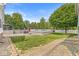 Landscaped backyard features an above-ground pool, a deck, and a white picket fence, perfect for outdoor relaxation at 7221 State Road 42, Martinsville, IN 46151