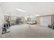 Spacious basement with carpet, fitness equipment, and bedroom area at 7221 State Road 42, Martinsville, IN 46151