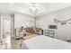 Bright bedroom features a ceiling fan, natural light, and ample space at 7221 State Road 42, Martinsville, IN 46151