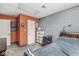 Bedroom with gray and orange brick walls, carpeted flooring, and natural light at 7221 State Road 42, Martinsville, IN 46151