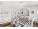 Cozy dining room features wood floors, stylish seating, and a rustic hutch for added charm at 7221 State Road 42, Martinsville, IN 46151