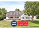 Charming home featuring a welcoming front porch, well-manicured lawn, and a classic design with dormer windows at 7221 State Road 42, Martinsville, IN 46151