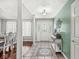 Elegant foyer showcasing decorative tile, a glass-paneled door, and views into the formal dining space at 7221 State Road 42, Martinsville, IN 46151