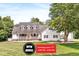 Charming two-story home with a welcoming front porch and well-manicured lawn at 7221 State Road 42, Martinsville, IN 46151