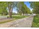 Expansive front lawn with mature trees and a long driveway leading to the house, creating a serene setting at 7221 State Road 42, Martinsville, IN 46151
