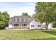 Charming two-story home with a welcoming front porch and a lush, well-manicured lawn at 7221 State Road 42, Martinsville, IN 46151