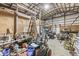 Spacious garage or workshop interior with exposed beams and ample storage space for tools and equipment at 7221 State Road 42, Martinsville, IN 46151