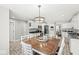 Spacious kitchen boasts eat-in dining area, white cabinetry, and stainless steel appliances at 7221 State Road 42, Martinsville, IN 46151