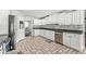 Bright kitchen with white cabinets, granite countertops, and stainless steel appliances for modern living at 7221 State Road 42, Martinsville, IN 46151