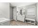 Bathroom with a soaking tub, vanity with a sink, and a large mirror at 7221 State Road 42, Martinsville, IN 46151