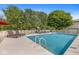Inviting above-ground pool with sun loungers and a play area, perfect for outdoor recreation and relaxation at 7221 State Road 42, Martinsville, IN 46151