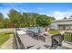 Above-ground pool surrounded by a deck with seating and a playset, offering a fun and relaxing backyard oasis at 7221 State Road 42, Martinsville, IN 46151