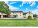 Back of house with in-ground pool with large manicured lawn at 7380 N 225 W, Lebanon, IN 46052