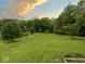 Expansive backyard with lush green grass and mature trees creates an inviting outdoor space at 7380 N 225 W, Lebanon, IN 46052