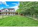 Spacious backyard with a chicken coop, mature trees, and well-manicured lawn at 7380 N 225 W, Lebanon, IN 46052