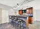 Finished basement featuring a bar area with seating for five, stylish lighting, and cherry cabinets at 7380 N 225 W, Lebanon, IN 46052