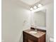 Bathroom featuring a vanity with granite countertop, and updated mirror and lighting fixtures at 7380 N 225 W, Lebanon, IN 46052