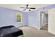 Bedroom features a ceiling fan, LED trim lighting, and carpeted floors at 7380 N 225 W, Lebanon, IN 46052