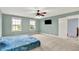 Bright bedroom featuring a ceiling fan, TV, and abundant natural light through multiple windows at 7380 N 225 W, Lebanon, IN 46052