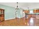 Open floor plan showcasing dining area connected to the kitchen with wooden cabinetry at 7380 N 225 W, Lebanon, IN 46052