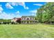 Classic two-story home featuring a spacious front yard, large trees, and inviting front porch at 7380 N 225 W, Lebanon, IN 46052