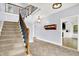 Grand foyer with elegant staircase, coat rack, and an open layout leading to the living areas at 7380 N 225 W, Lebanon, IN 46052