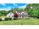 Charming two-story home with a welcoming front porch, mature landscaping, and a well-manicured lawn at 7380 N 225 W, Lebanon, IN 46052