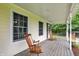 Cozy front porch with wooden rocking chairs, perfect for enjoying peaceful outdoor moments at 7380 N 225 W, Lebanon, IN 46052