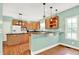 Charming kitchen with wooden cabinets, granite countertops, and a breakfast bar at 7380 N 225 W, Lebanon, IN 46052