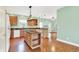 Kitchen with island, granite countertops, and hardwood floors at 7380 N 225 W, Lebanon, IN 46052