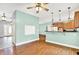 Open kitchen with wooden cabinets, granite countertops, and stainless steel appliances at 7380 N 225 W, Lebanon, IN 46052