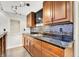 Finished basement featuring a kitchenette with cherry cabinets, granite counters, and stylish backsplash at 7380 N 225 W, Lebanon, IN 46052