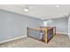 Second floor landing with wood railings, carpet, and easy access to upstairs bedrooms at 7380 N 225 W, Lebanon, IN 46052