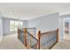 Upper landing featuring wood railings and a bright airy feel at 7380 N 225 W, Lebanon, IN 46052