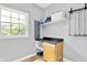 Bright laundry room with window, countertop, and storage shelves at 7380 N 225 W, Lebanon, IN 46052