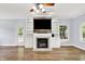 Bright living room features hardwood floors and a fireplace flanked by built-in shelves and cabinets at 7380 N 225 W, Lebanon, IN 46052
