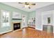 Bright living room features a fireplace, built-in shelves, and a view of the pool at 7380 N 225 W, Lebanon, IN 46052