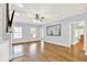 Sunlit living room features hardwood floors, a fireplace, and large windows at 7380 N 225 W, Lebanon, IN 46052