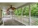 Screened in porch with ceiling fans providing a relaxing view of the treed yard at 7380 N 225 W, Lebanon, IN 46052