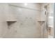 Tiled shower with shower head and integrated shelving at 7380 N 225 W, Lebanon, IN 46052