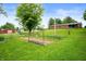 Sprawling backyard with garden, barn, and shed, ideal for gardening and outdoor activities at 8027 S 250 E, Markleville, IN 46056