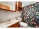 Cozy bathroom with mushroom-themed shower curtain and a vanity with ample storage space at 8027 S 250 E, Markleville, IN 46056