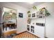 Bright breakfast nook with white cabinets, shelving, and a view into an adjacent dining area at 8027 S 250 E, Markleville, IN 46056