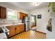 Classic kitchen featuring wooden cabinets, stainless steel refrigerator, and bright natural light at 8027 S 250 E, Markleville, IN 46056
