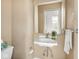 Bathroom with white porcelain sink and a framed mirror at 914 English Ave, Indianapolis, IN 46203