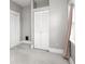 Neutral bedroom featuring a closet with white folding doors, light grey walls, and plush carpet flooring at 914 English Ave, Indianapolis, IN 46203